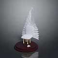 White Chair Shaped Sculpture With Feather Backrest Dark Base And Golden Legs