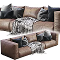 Brown Three Seater Leather Sofa With Gray Black Pillows And Striped Blanket