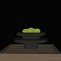 Minimalist Bonsai Plant With Green Moss On Black Layered Base And Wooden Table
