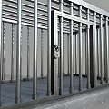 Metal Detention Cage With Steel Bars Stone Base And Lockable Door