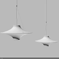 Two Modern White Disc Shaped Chandeliers Hanging With Black Cords On Grey Background