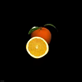 Fresh Ripe Oranges With Whole And Sliced Pieces And Green Leaves