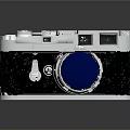 Vintage Electronic Camera With Silver Metal Body Blue Lens And Classic Design