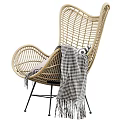 Modern Rattan Leisure Chair With Beige Black Design Soft Pillows And Stylish Blankets