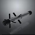 Military Missile With Silver Cylindrical Body Black Stabilizing Fins And Front Warhead