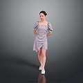 Woman In Floral Print Puffed Sleeve Dress With White Shoes Standing Against Simple Gray Background
