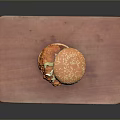 Delicious Juicy Hamburger With Sesame Seed Bun On Wooden Cutting Board