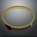 Elegant Golden Bangle With Red Heart Decoration And Smooth Polished Surface