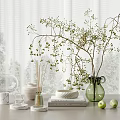 Decorative Ornament Set with Green Vase Twigs Glass Cover Books and Green Apples on Table
