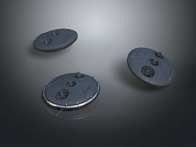 Three Circular Metallic Components With Holes And Raised Parts On Dark Background 3d model