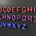 Vibrant 3D Alphabet Letters in Red Purple Blue Displayed on Dark Background