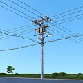 Roadside Utility Pole with Power Lines Street Lamp Blue Sky Grass and Trees