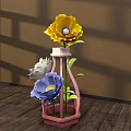 Floral Display with Pink Hexagonal Vase Yellow White Blue Flowers Green Leaves on Wooden Floor Shadow Effects