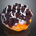 Delicious Golden Brown Donut Topped With Chocolate Crumbs And White Icing
