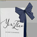 Check in Table With Blue Tablecloth And Bow Decoration For Event Ceremony