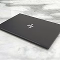 HP Black Closed Laptop With Sleek Modern Design On Marble Surface