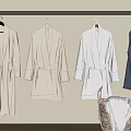 Cozy Bathrobes Hanging On Wall In Neutral And Dark Blue With Wicker Basket Holding Towels
