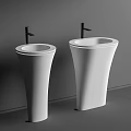 Two White Pedestal Washbasins With Black Faucets On Grey Background