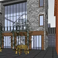 Multi Story Waterfront Commercial Street with Stone Glass Buildings Balconies Wooden Railing and Street Lamps
