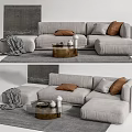 Light Gray Sectional Sofa With Brown Pillows Knitted Blanket And Wooden Coffee Table