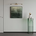 Abstract Painting on White Wall with Astronaut Model on Transparent Glass Cabinet Below