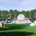 Royal Theme Kids Playground With Sandpit Circular Structures Green Plants And Colorful Flooring