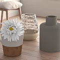 Decorative Items on Wooden Table White Daisy in Ceramic Mug Woven Glass Gray Cylindrical Vases