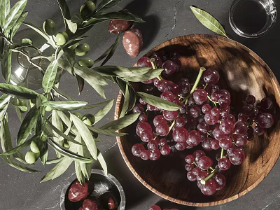 Fresh Red Grapes in Wooden Bowl with Olive Branches and Green Olives on Dark Surface 3d model