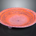 Carved Orange Decorative Dish With Intricate Edge Patterns And Small Base Stand