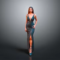 Elegant Woman in Deep Blue Gown with High Slit and High Heels on Gray Background