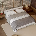 Double Bed In Cozy Bedroom With Gray White Quilt Bedside Table And Wooden Floor