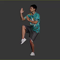A Man In Green Printed T Shirt Gray Shorts White Sneakers Striking Dynamic Pose