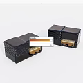 Two Black Electronic Devices With Square Design And Golden Connectors