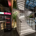 Modern Restaurant Interior Design With Spiral Staircase Green Plants Display Counters And Decorative Artworks