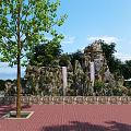 Scenic Park Landscape With Green Trees Rock Formation White Pillars And Brick Paved Ground