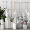 White Angel And Human Head Sculptures On Marble Pedestals With Decorative Wall And Green Plants