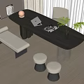 Modern Oval Black Table With Beige Chair Bench Stools Laptop Magazine And Green Plant