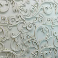 Elegant White Wall With Intricate 3D Relief Floral Scroll Patterns And Carved Details
