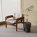 Leisure Chair With Wooden Frame Beige Cushion Side Table Green Plant Sunlit Room