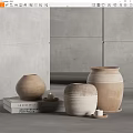 Minimalist Ceramic Vessels With Textured Design On Books And Small Candles Gray Background