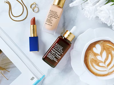 Elegant Cosmetics Display Featuring Lipstick Foundation Facial Serum Gold Necklace Rings White Flowers And Coffee 3d model