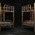 Old Rusted Bunk Beds With Mattresses And Blankets In Dim Room