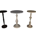 Three Different Metal Side Tables With Ornate Bases And Round Tops In Gold Silver Black