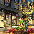 Scenic Pedestrian Street View With Colorful Flowers Neon Light Decorations And Building Exterior