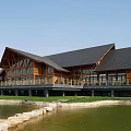 Scenic Wooden Building With Gabled Black Roof Large Windows By Pond And Deck