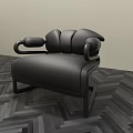 Modern Black Single Sofa Featuring Unique Armrest Design Against Light Wall On Herringbone Floor 3d model