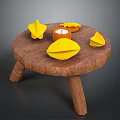 Wooden Round Table With Bright Yellow Origami Shapes And Small Decorative Candle