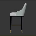 Light Colored Upholstered Bar Stool With Black Legs And Gold Accents