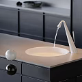 Modern Black Silver and White Faucet with Water Flowing on Kitchen Countertop