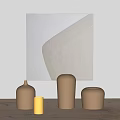 Decorative Ornament Set on Wooden Table with Abstract Painting Including Yellow Cylinder and Brown Vases